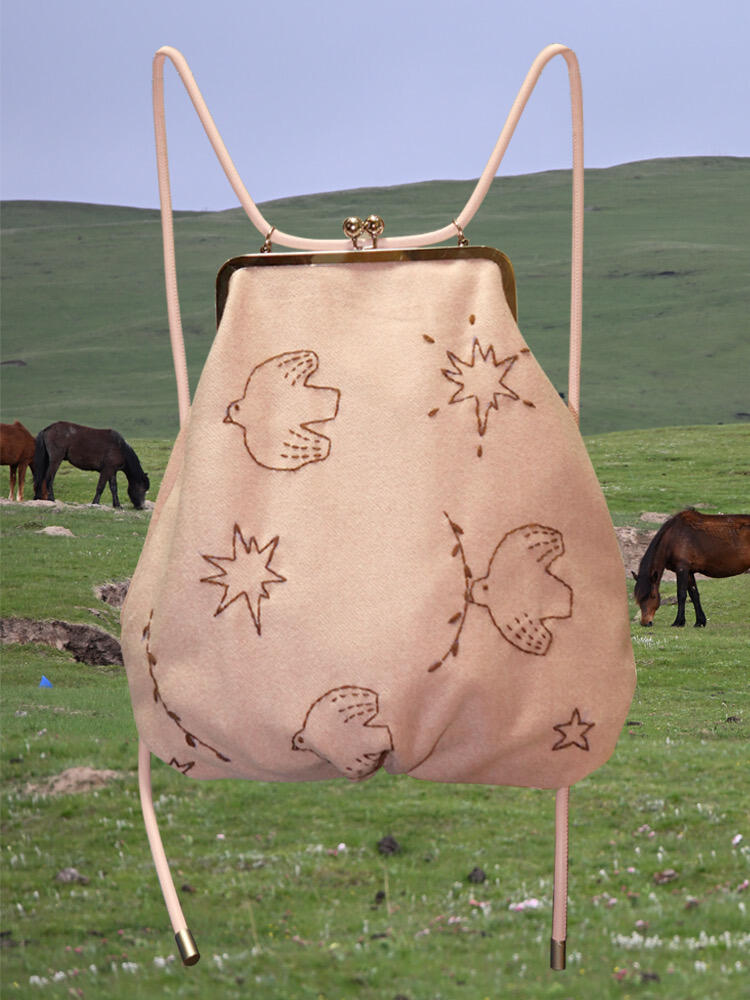 Bird Embroidered Kiss Lock Backpack