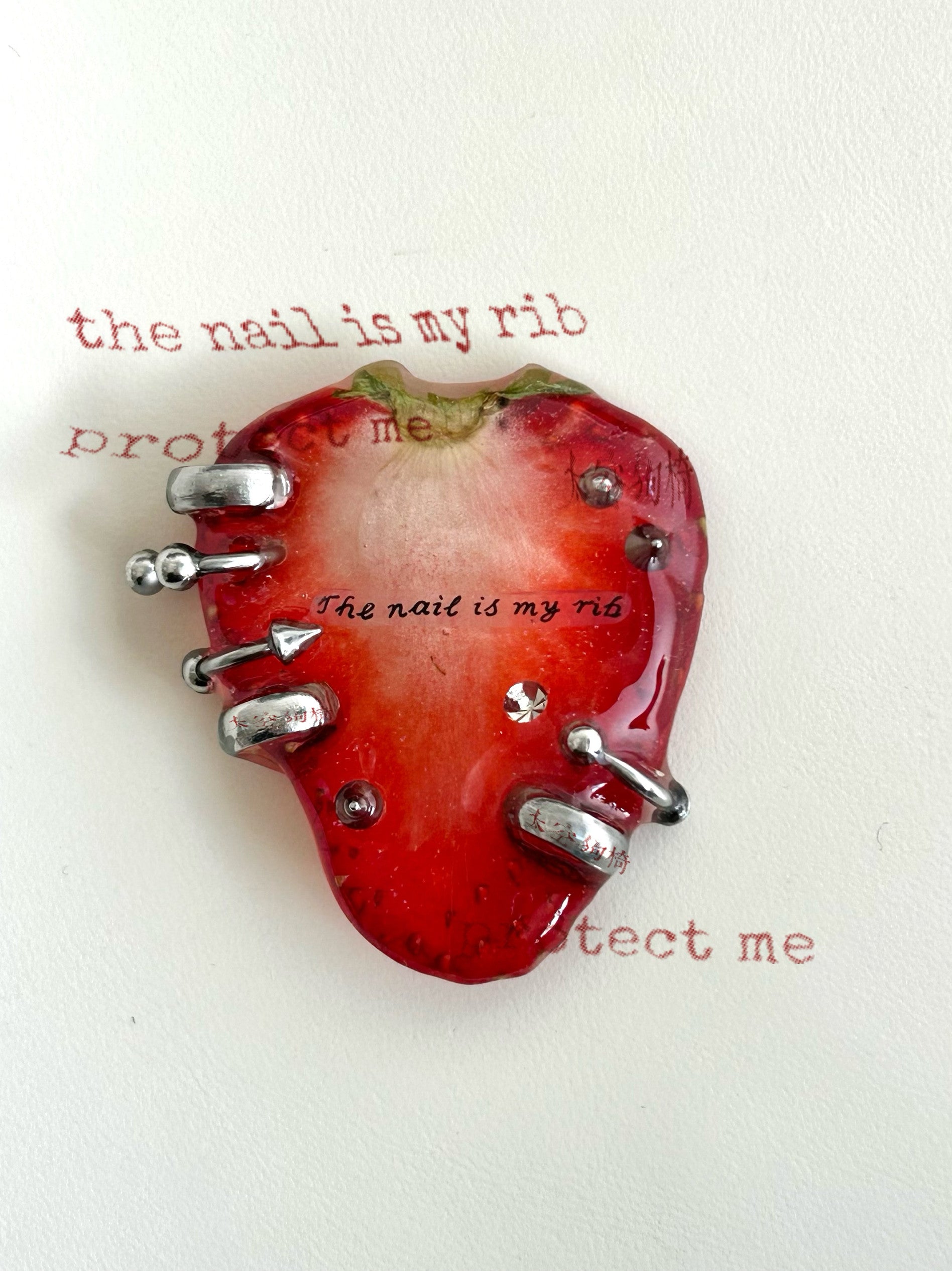 “Nails Are My Ribs” Strawberry Resin Necklace | Necklace | Three Fleas